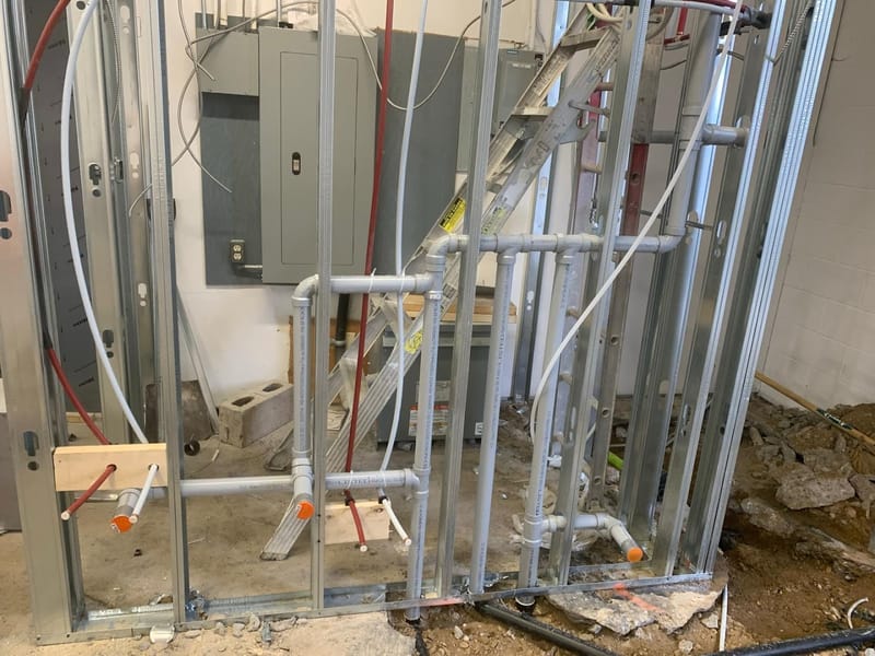 Commercial steel-stud plumbing rough-in